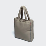 CLOUD7_ The Hundereisebett & Tote Bag AKTIV Puffer Khaki/Peach is a soft, light tote with padded handles, front zipper pockets, gold logo detail, and a modern minimalist design—ideal for stylish pet travel.